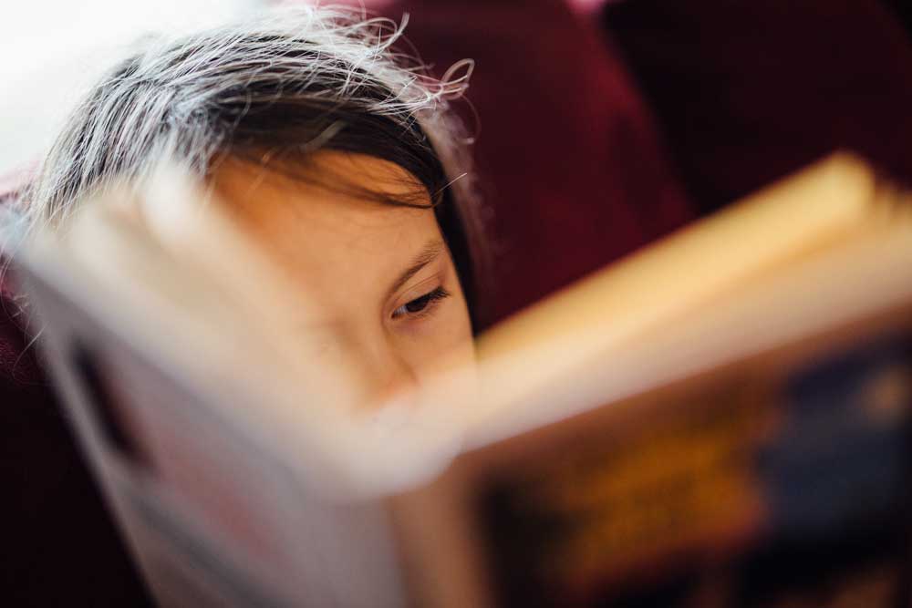 close up of a girl reading